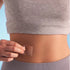 Image of patch being placed on the abdomen of a lady